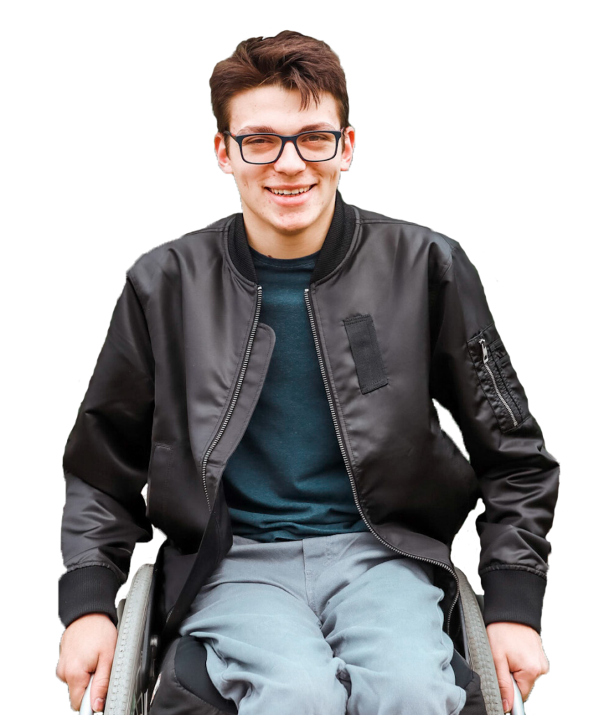 A man in a wheelchair smiling